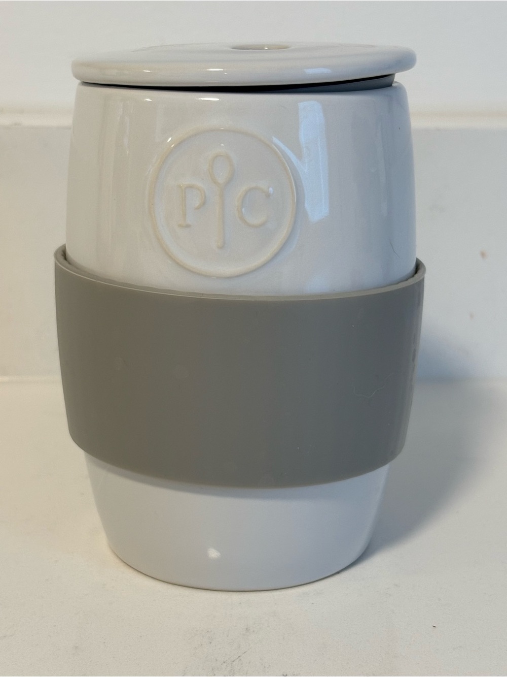 Pampered Chef White Ceramic Travel Mug with Gray Silicone Grip